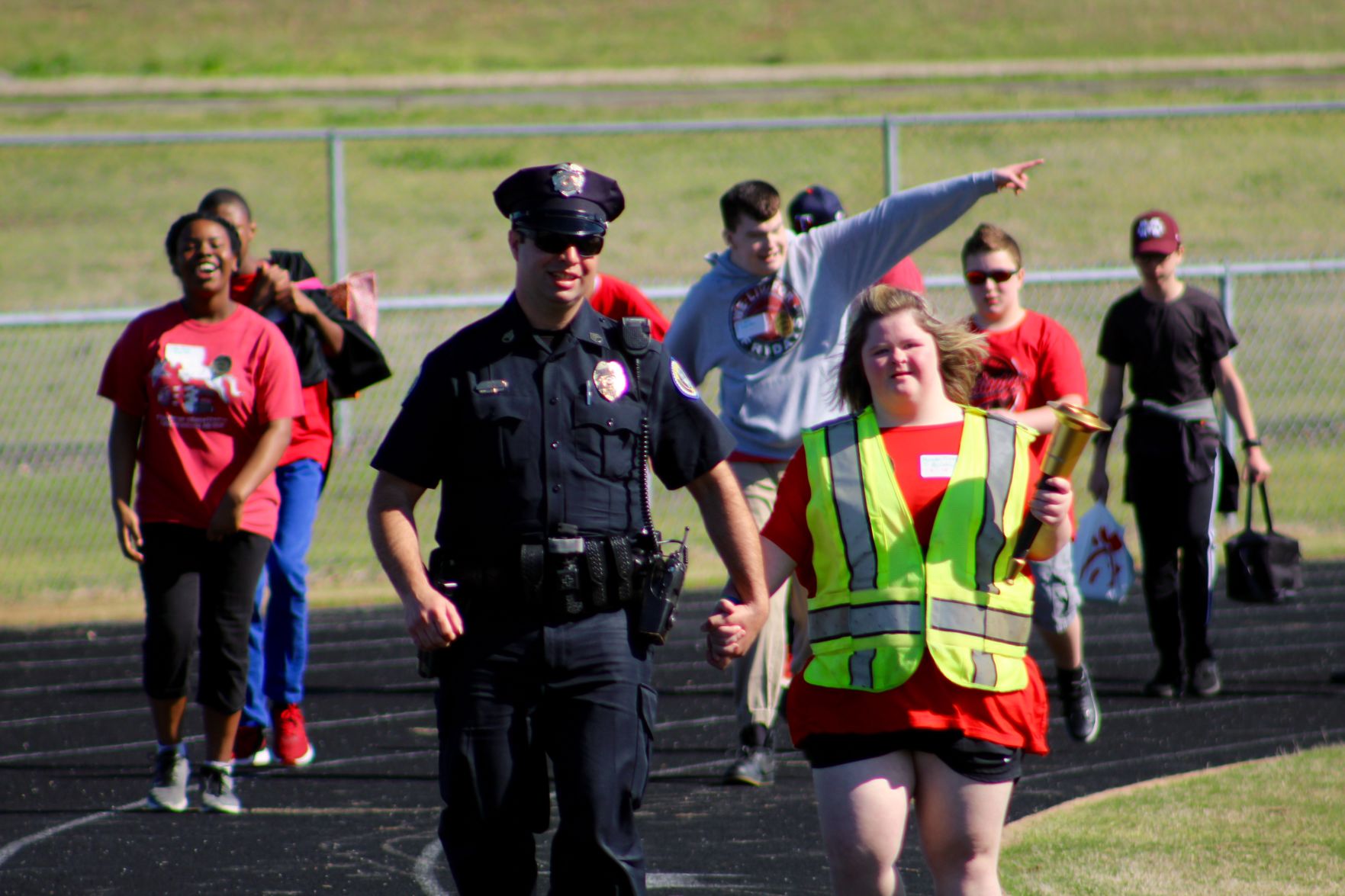 Special Olympics torch bearer opens meet